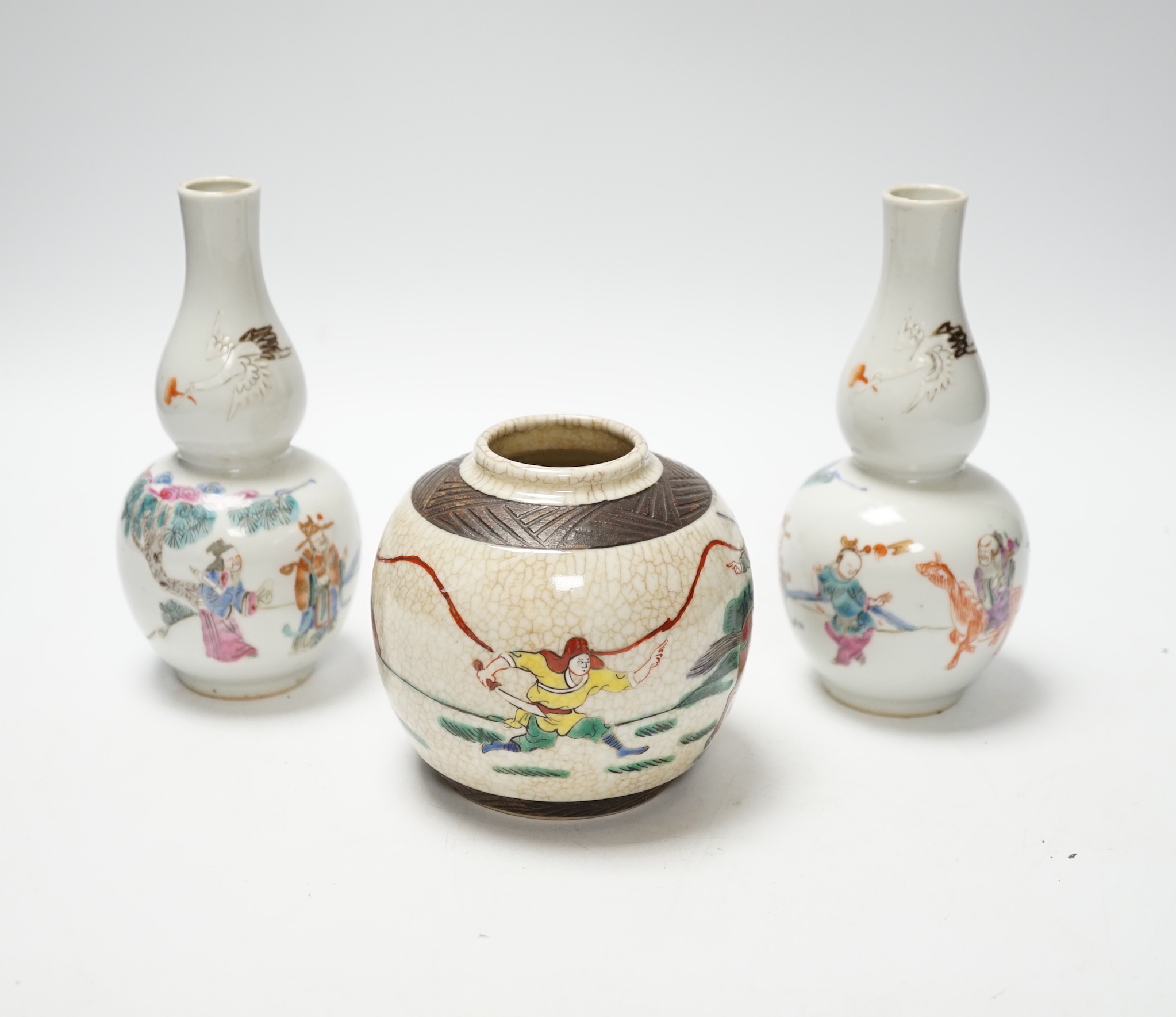A pair of Chinese double gourd shaped vases and a small ginger jar, vases 15cm (3)